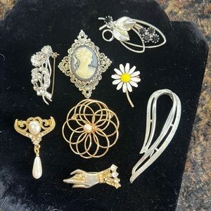 8 Antique Brooches in great shape. 1 price